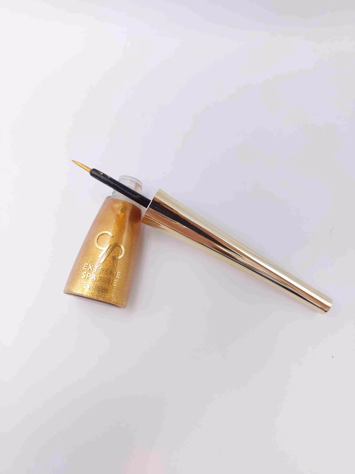 خط چشم ماژیکی کوزه ای ضد آب رنگ مشکی براق لیکوئید آیلایتر شماره 103 GOLDEN ROSE Extreme Sparkle — تصویر ۲